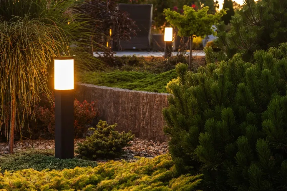 Garden bollard lighting along a landscaped bed